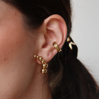Aretes María
